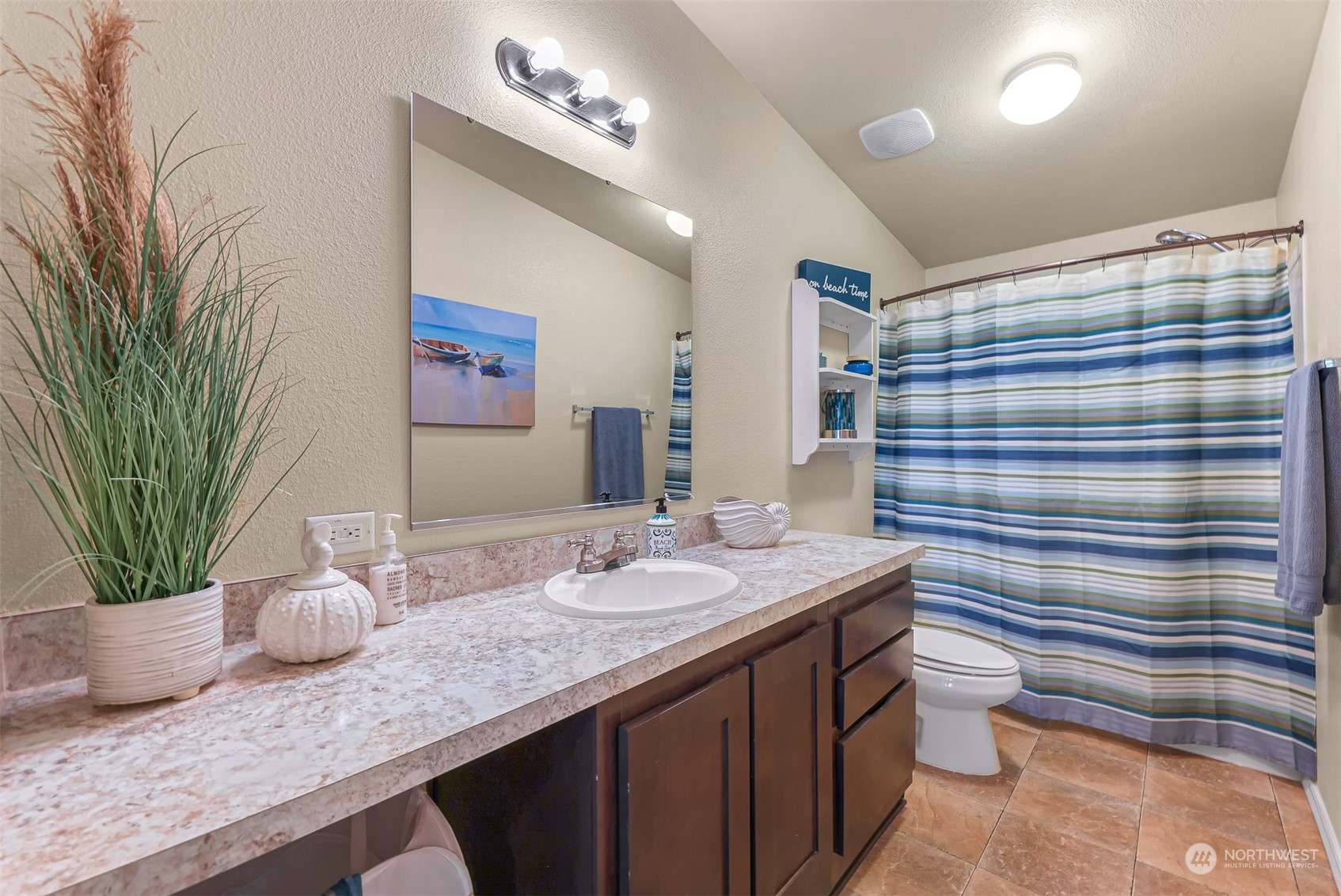 4524 Decatur Drive Ferndale, WA 98248 - Photo 30 of 30 a bathroom with a granite countertop sink a toilet a mirror and shower curtain