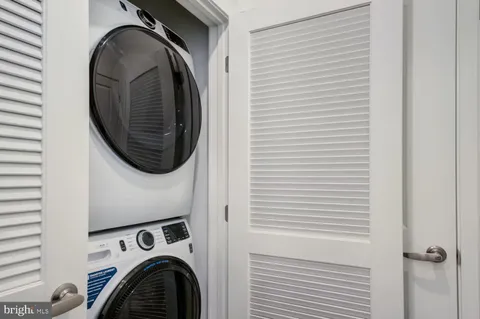 a kitchen with stainless steel appliances a refrigerator sink and microwave