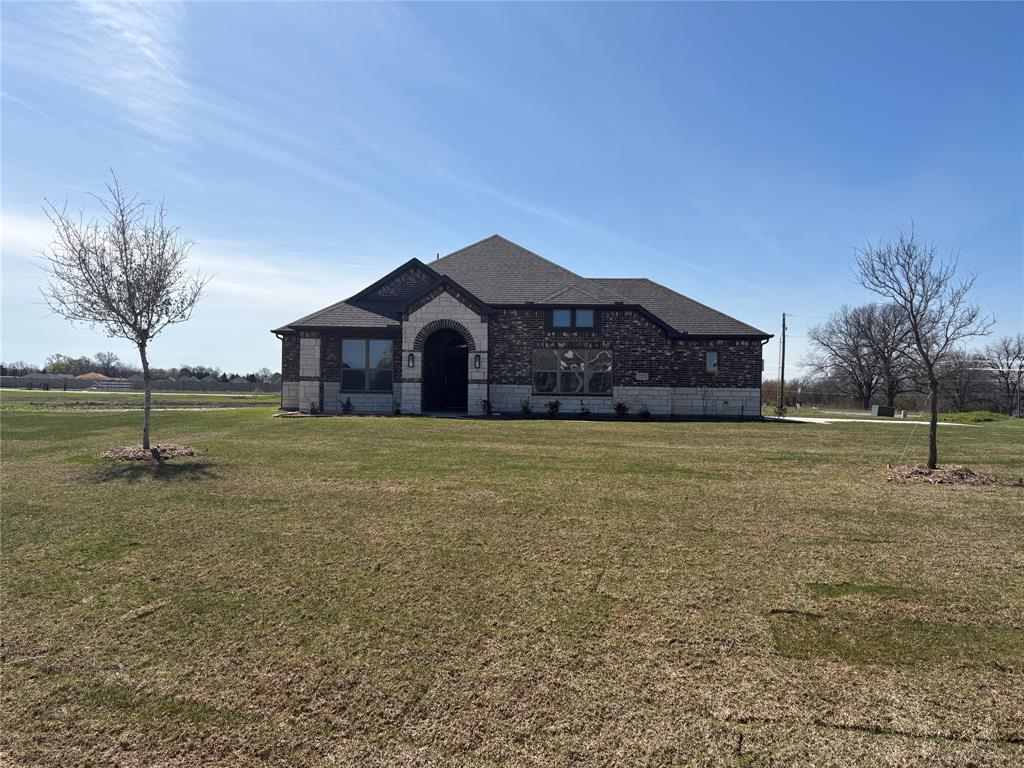 822 Sanders Road Whitesboro, TX 76273 - Photo 1 of 1 a front view of a house with a yard