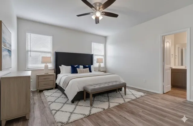 a bedroom with a bed and window