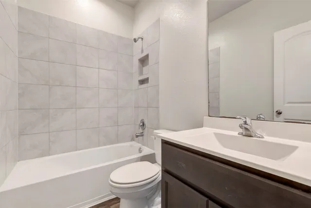 a bathroom with a sink a toilet and a bathtub