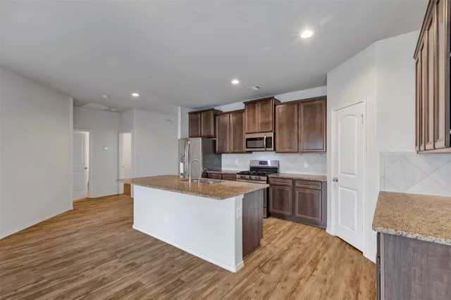 a bathroom with a double vanity sink a mirror and a shower