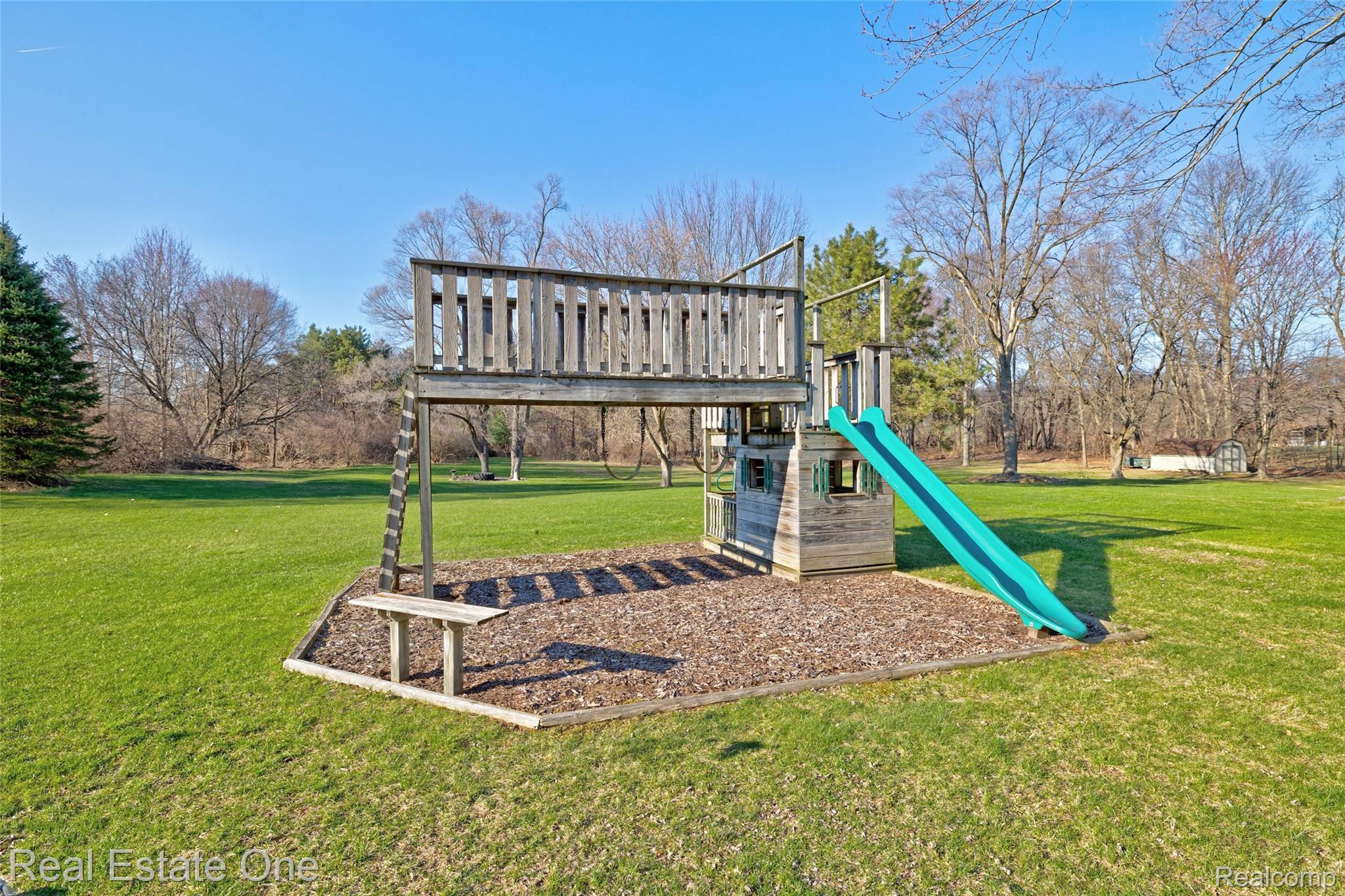 6400 Oakhill Road Ortonville, MI 48462 - Photo 75 of 82 View of jungle gym featuring a lawn