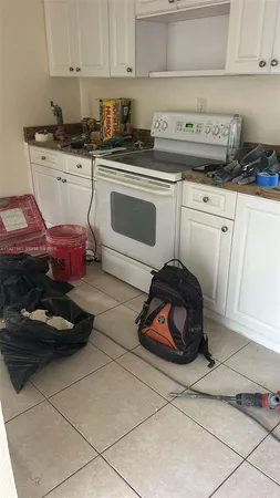 a living room with lots of furniture and gym equipment