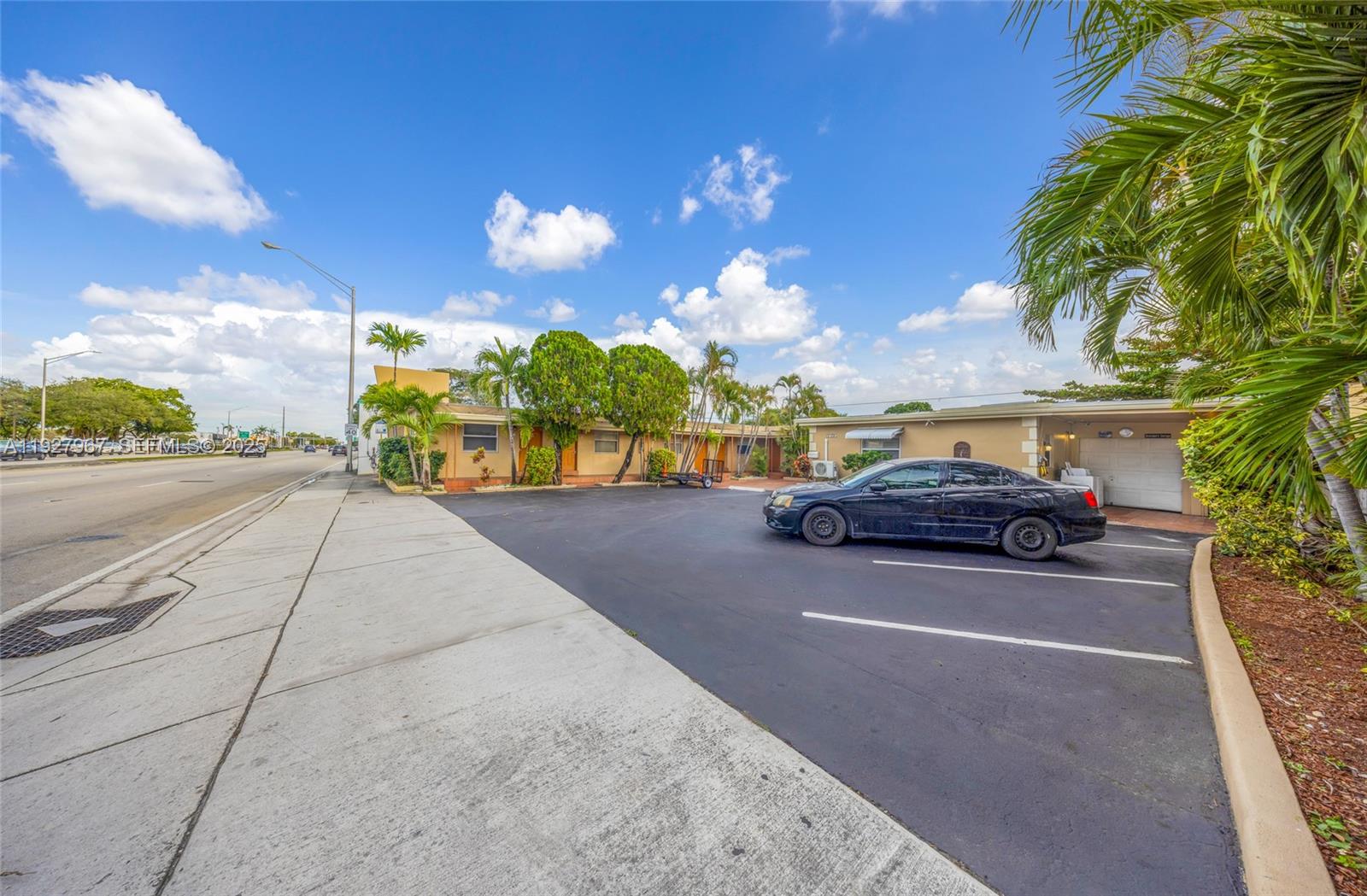 6124 Pembroke Road Miramar, FL 33023 - Photo 2 of 20 a view of a street with cars on road