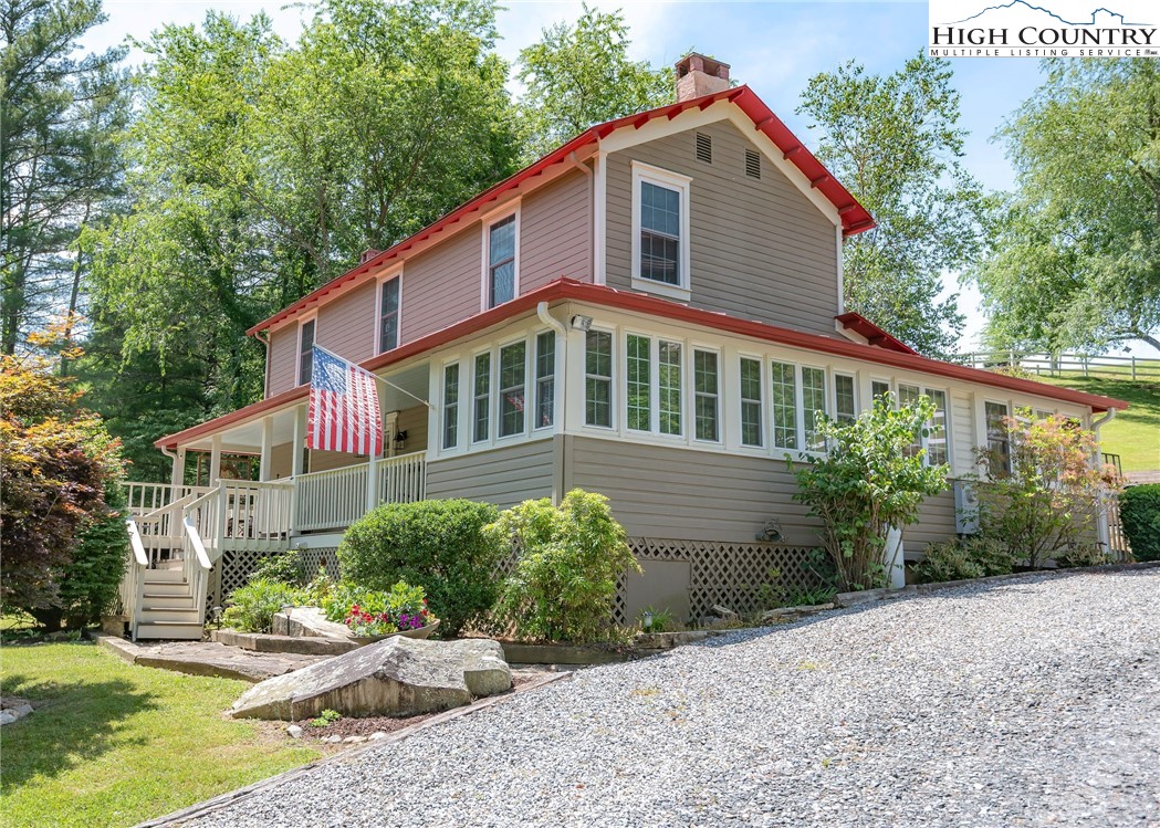 2280 Garvey Bridge Road Crumpler, NC 28617 - Photo 1 of 45 a front view of a house with a yard