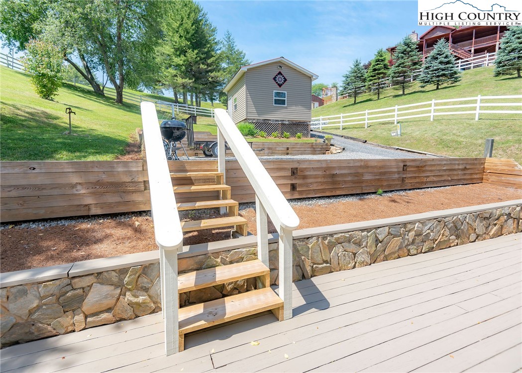 2280 Garvey Bridge Road Crumpler, NC 28617 - Photo 13 of 45 a view of swimming pool with a lounge chairs
