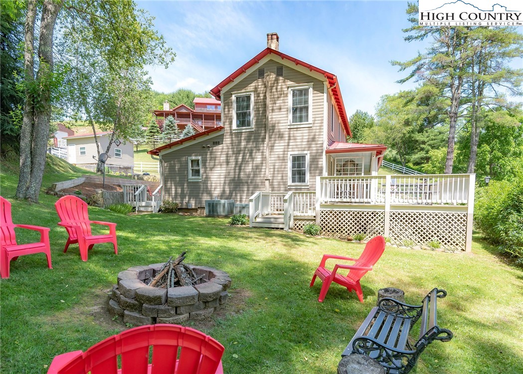 2280 Garvey Bridge Road Crumpler, NC 28617 - Photo 16 of 45 a view of an house with backyard space and patio