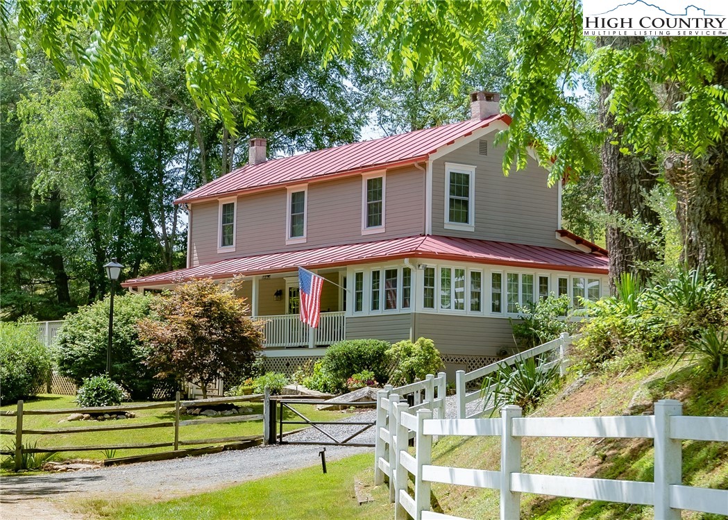 2280 Garvey Bridge Road Crumpler, NC 28617 - Photo 2 of 45 a front view of a house with a yard
