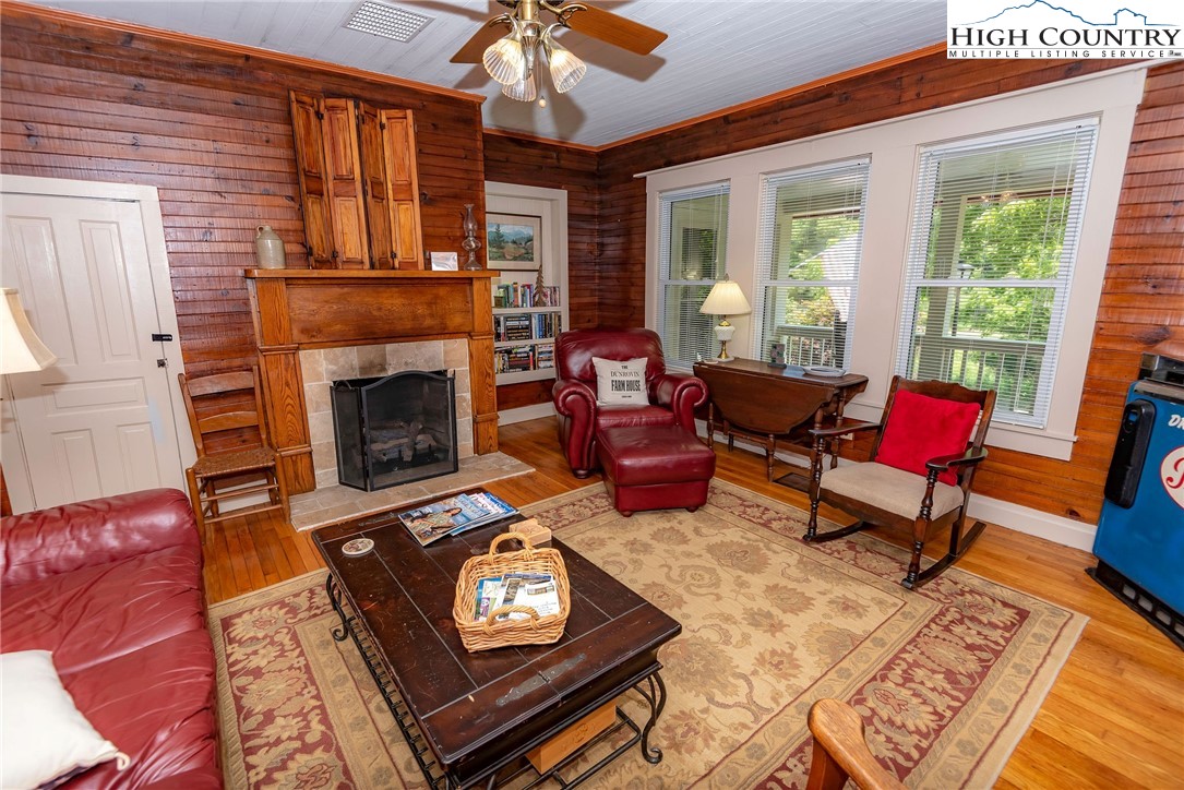 2280 Garvey Bridge Road Crumpler, NC 28617 - Photo 21 of 45 a living room with furniture and a fireplace