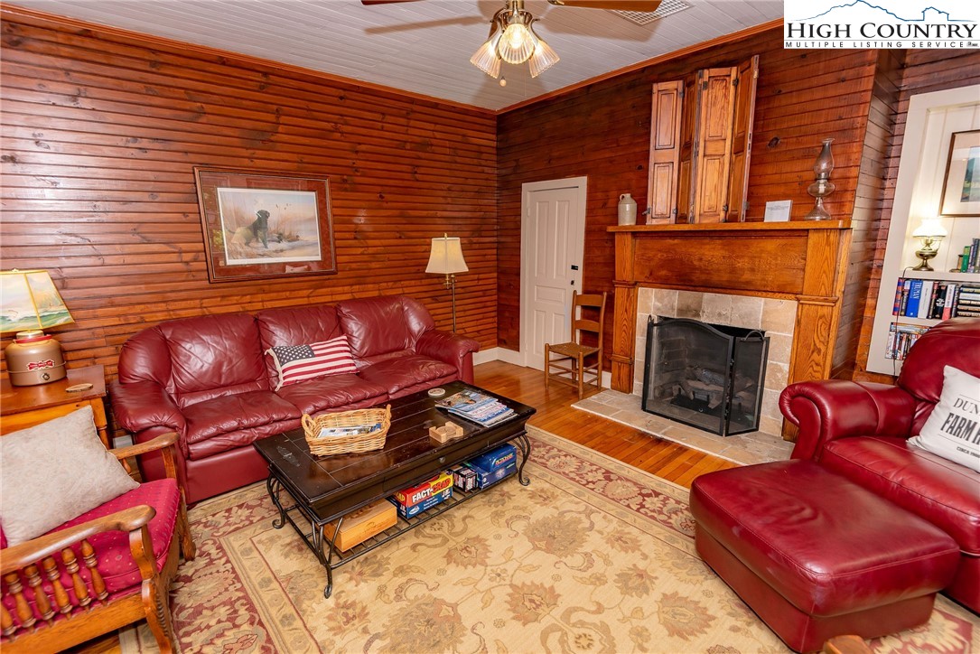 2280 Garvey Bridge Road Crumpler, NC 28617 - Photo 22 of 45 a living room with furniture and a fireplace