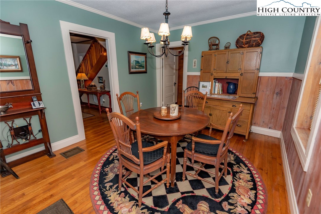 2280 Garvey Bridge Road Crumpler, NC 28617 - Photo 24 of 45 a dining room with furniture and wooden floor