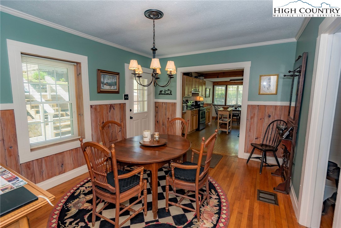2280 Garvey Bridge Road Crumpler, NC 28617 - Photo 25 of 45 a view of a dining room with furniture window and wooden floor