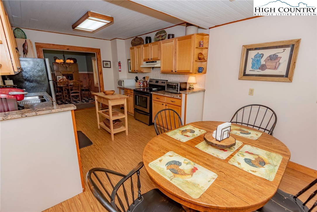 2280 Garvey Bridge Road Crumpler, NC 28617 - Photo 29 of 45 a view of a dining room with furniture