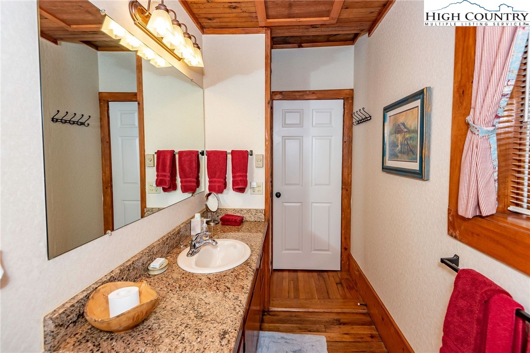 2280 Garvey Bridge Road Crumpler, NC 28617 - Photo 36 of 45 a bathroom with a sink and a mirror