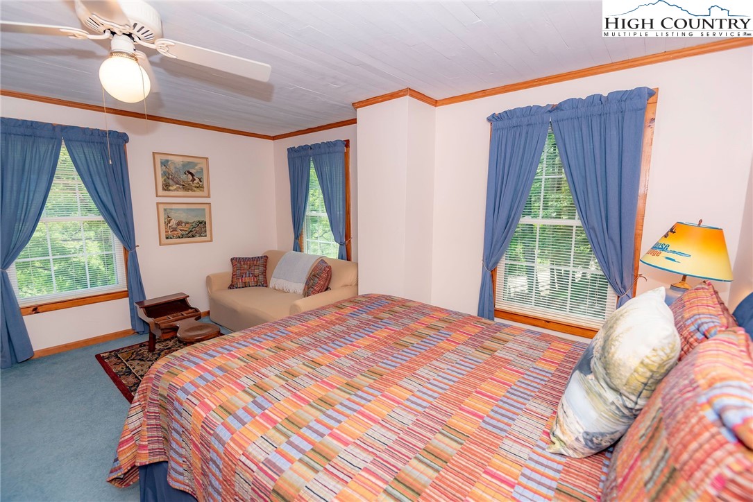 2280 Garvey Bridge Road Crumpler, NC 28617 - Photo 40 of 45 a bedroom with a bed and a window