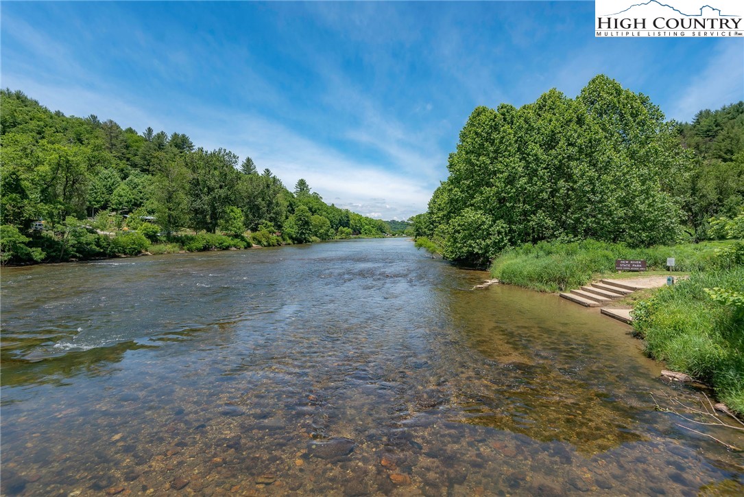 2280 Garvey Bridge Road Crumpler, NC 28617 - Photo 45 of 45 a view of a yard with plants and a bench