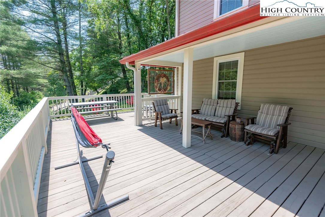 2280 Garvey Bridge Road Crumpler, NC 28617 - Photo 8 of 45 a view of sitting area with wooden floor and roof