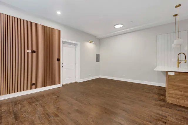 a view of a livingroom with wooden floor