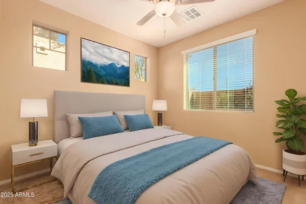 a bedroom with a bed and a lamp