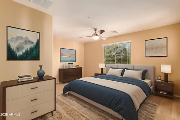 a bedroom with a bed and a window