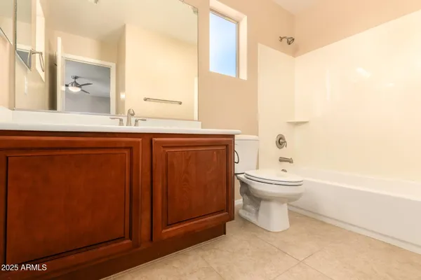 a bathroom with a toilet a sink and bathtub