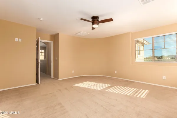 an empty room with a empty space and windows