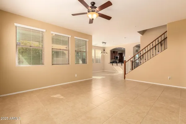 a view of an room with workspace and windows
