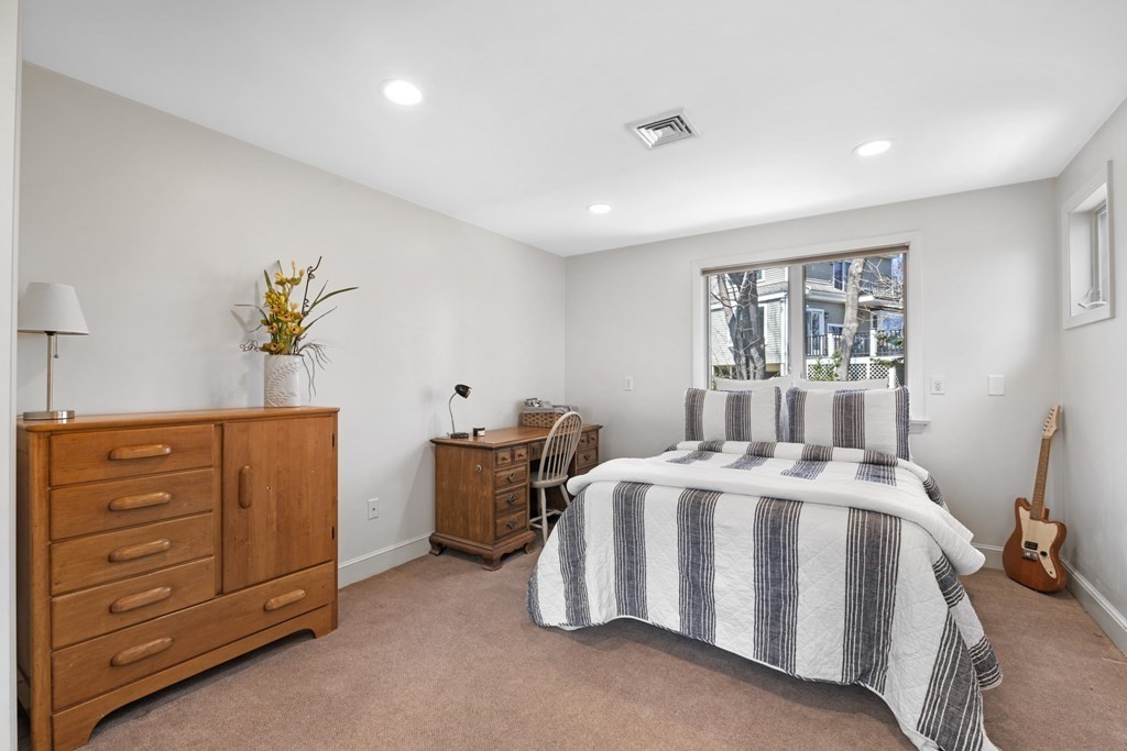 1 Wallingford Road Marblehead, MA 01945 - Photo 30 of 42 a bedroom with a bed and a dresser