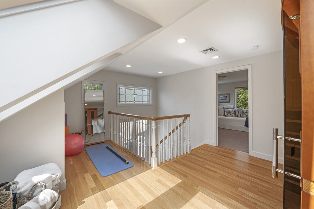 1 Wallingford Road Marblehead, MA 01945 - Photo 33 of 42 a bedroom with a bed and wooden floor