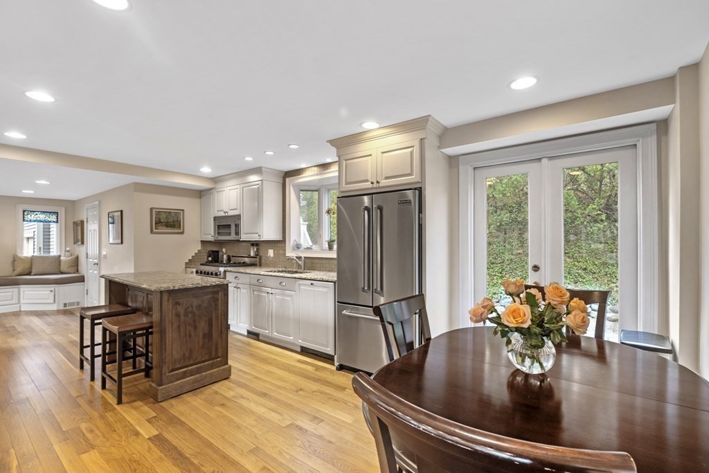 1 Wallingford Road Marblehead, MA 01945 - Photo 6 of 42 a kitchen with sink refrigerator dining table and chairs