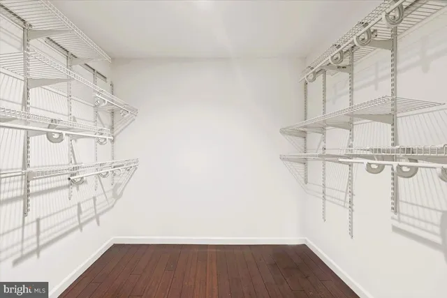 a bathroom with a sink mirror bathtub and window