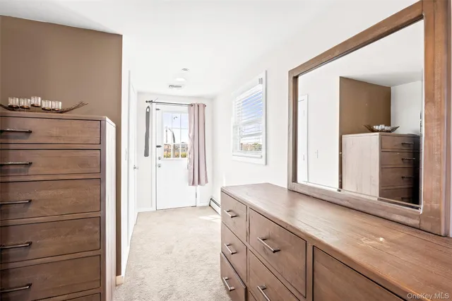 a view of kitchen with cabinets and flat screen tv