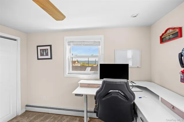 a view of a workspace with furniture