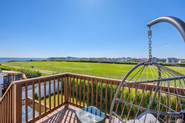 a view of a balcony with an ocean