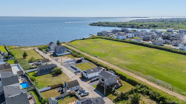 an aerial view of a pool patio swimming pool and outdoor seating
