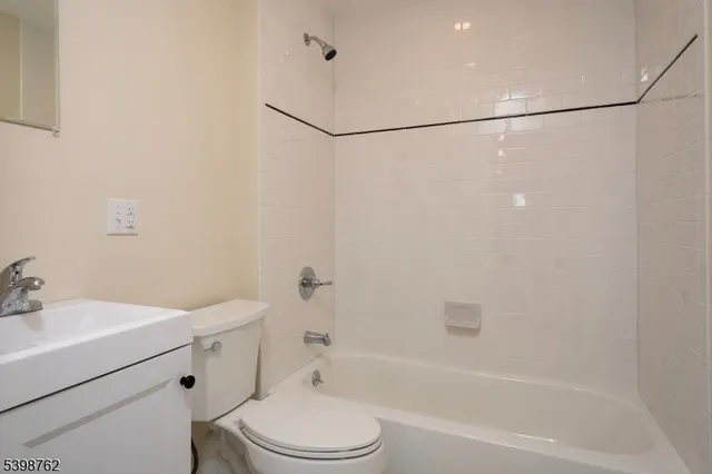 a bathroom with a toilet sink and shower