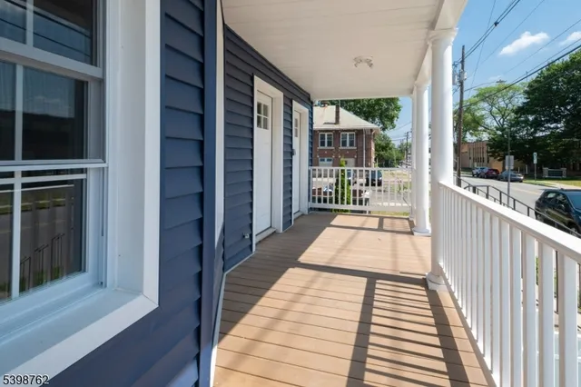 a view of a balcony with wooden floor