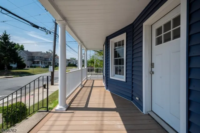a view of a balcony with wooden floor