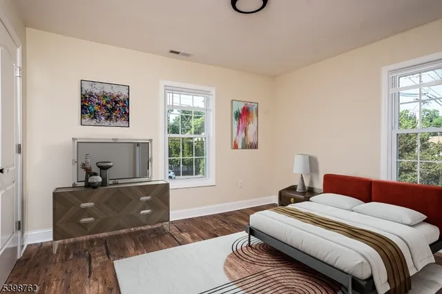 a bedroom with a bed and a couch