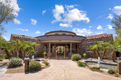 a view of a chairs and table in patio