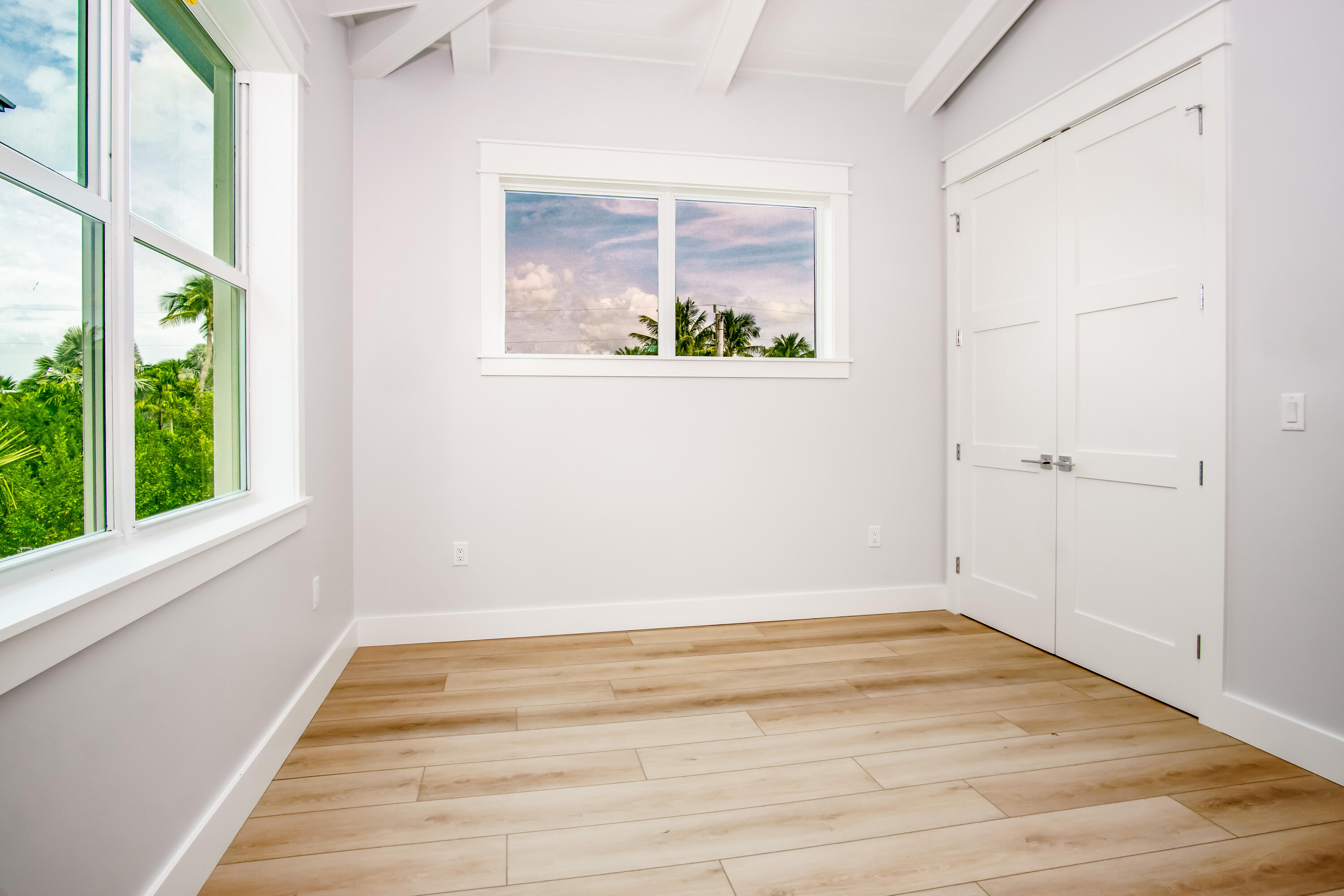 105 Carroll Street, Unit 6 Islamorada, FL 33036 - Photo 13 of 31 a view of a room with wooden floor and a window