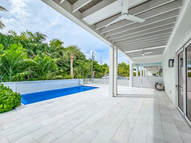 a view of swimming pool with an outdoor seating
