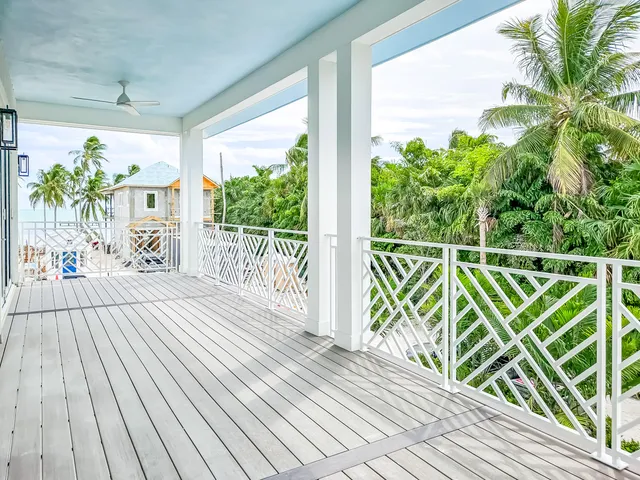 a view of a balcony with wooden floor
