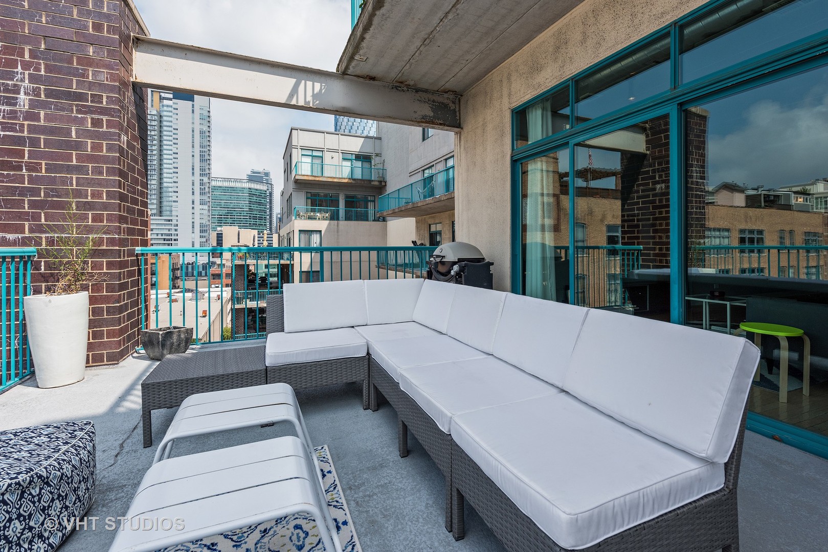920 West Madison Street, Unit F8 Chicago, IL 60607 - Photo 12 of 14 a balcony with furniture and a potted plant