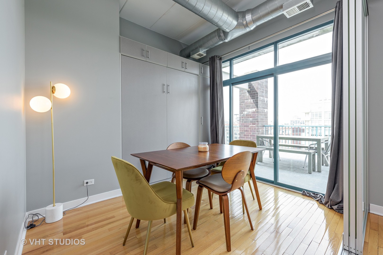 920 West Madison Street, Unit F8 Chicago, IL 60607 - Photo 5 of 14 a dining room with furniture and wooden floor