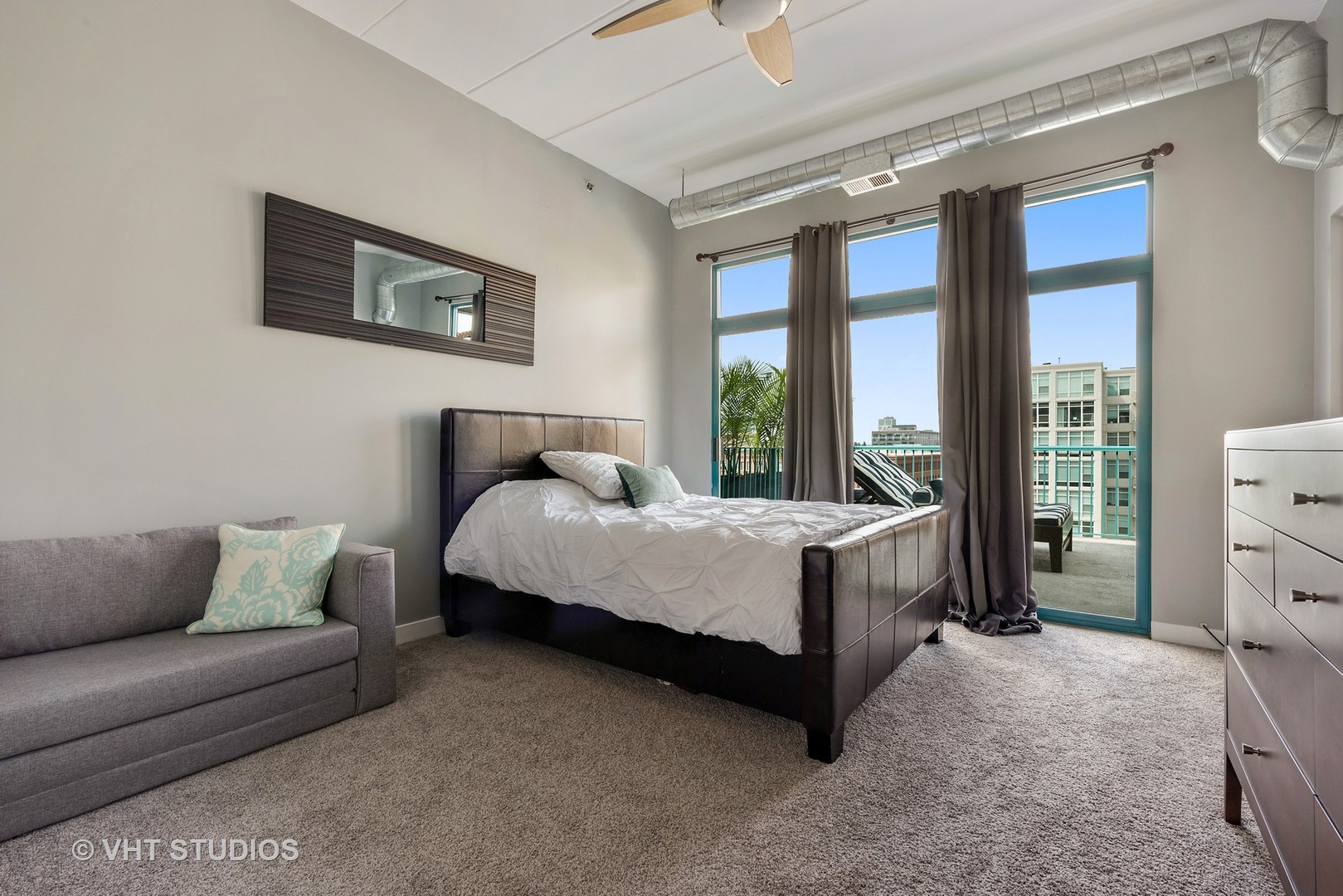 920 West Madison Street, Unit F8 Chicago, IL 60607 - Photo 6 of 14 a bed room with a bed and a couch
