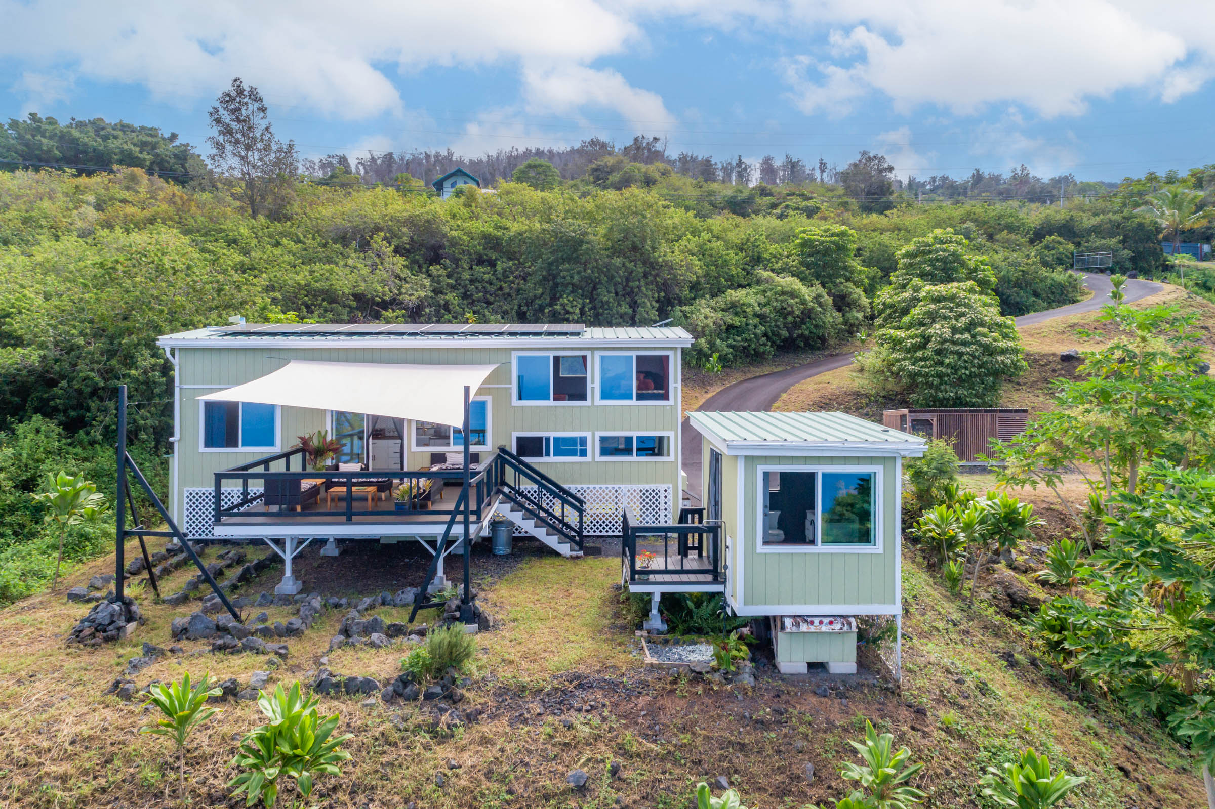 87-2793 Hawaii Belt Road Captain Cook, HI 96704 - Photo 17 of 30 an aerial view of a house with a yard table and chairs