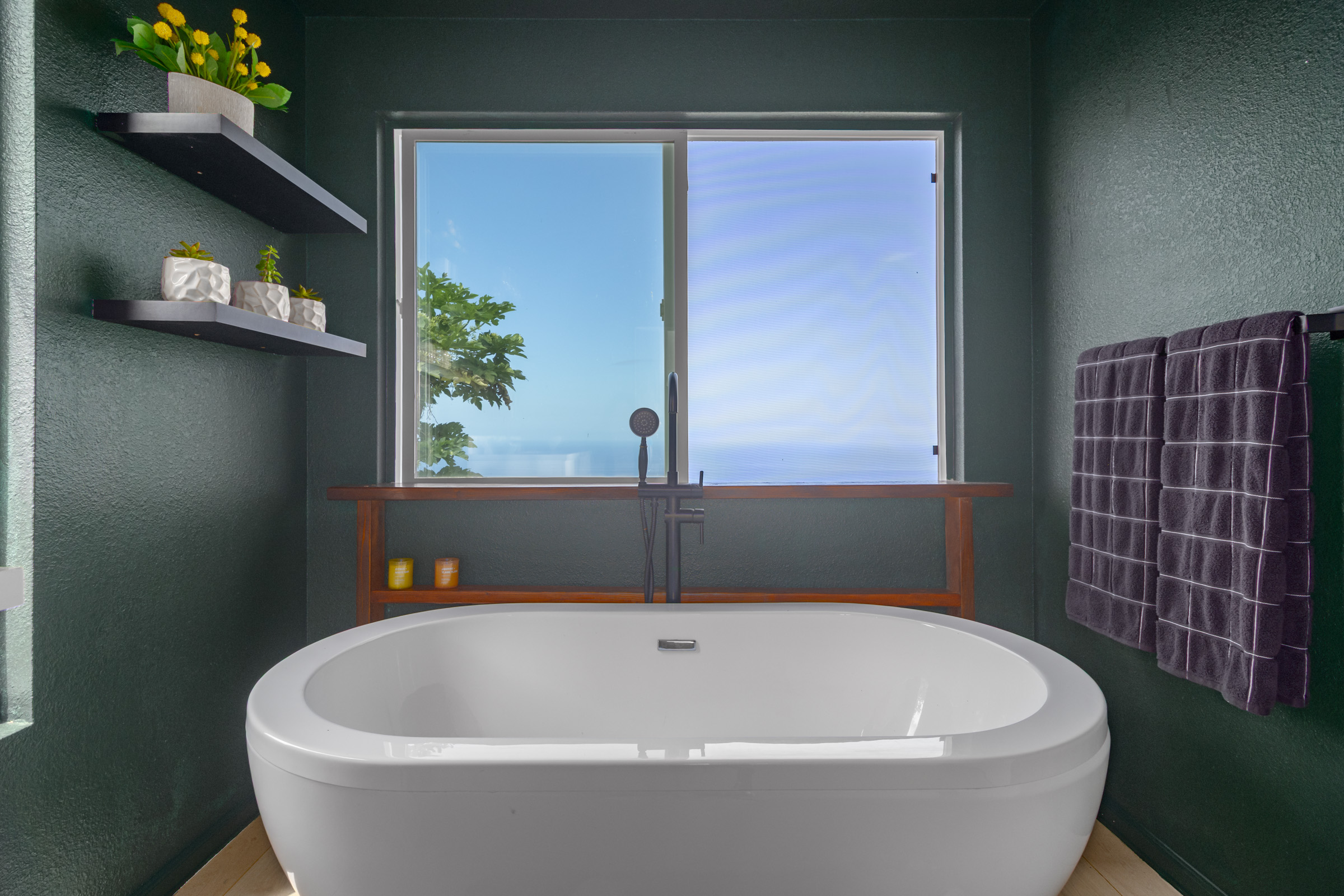 87-2793 Hawaii Belt Road Captain Cook, HI 96704 - Photo 21 of 30 a white bath tub sitting in a bathroom