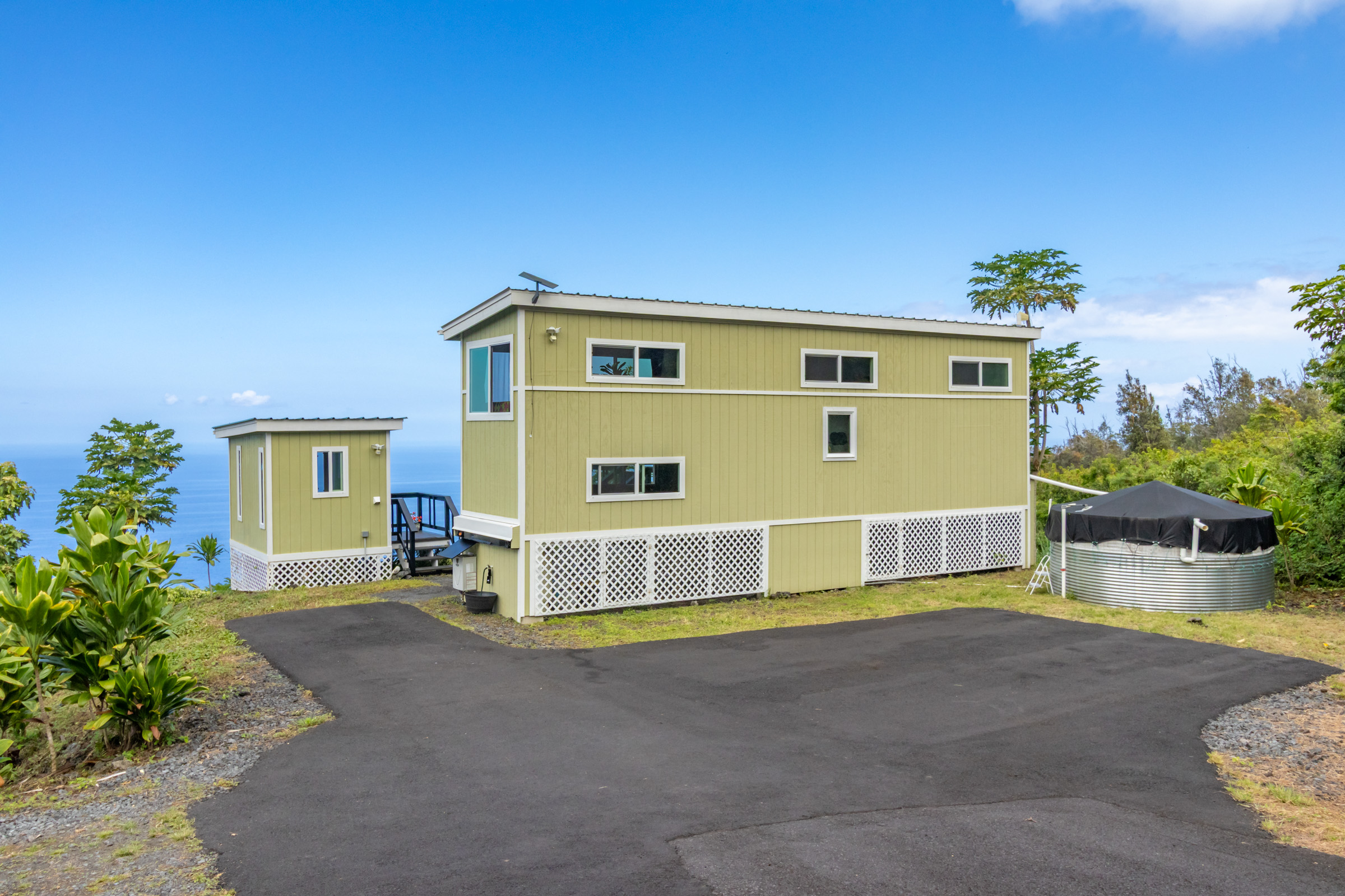 87-2793 Hawaii Belt Road Captain Cook, HI 96704 - Photo 24 of 30 a front view of a house with a yard